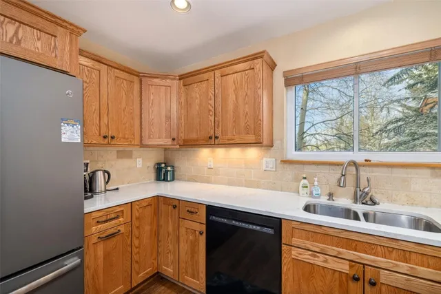a kitchen with a stove a sink and a microwave
