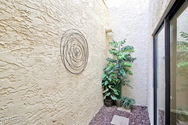 a bathroom with a sink shower and a mirror