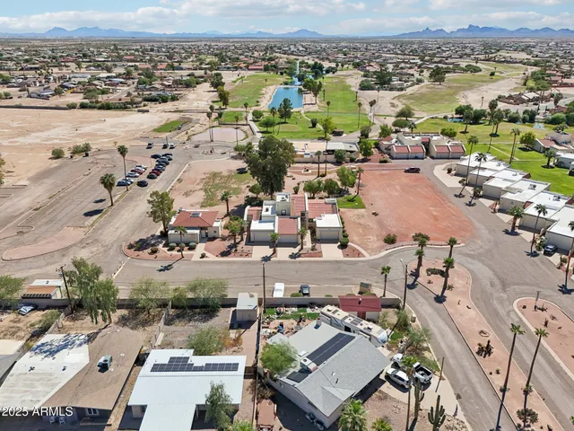 an aerial view of residential houses with outdoor space