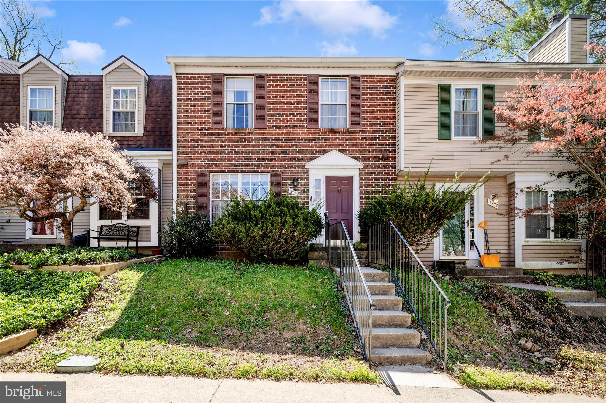 11704 Lone Tree Court Columbia, MD 21044 - Photo 2 of 38 a front view of a house with a yard