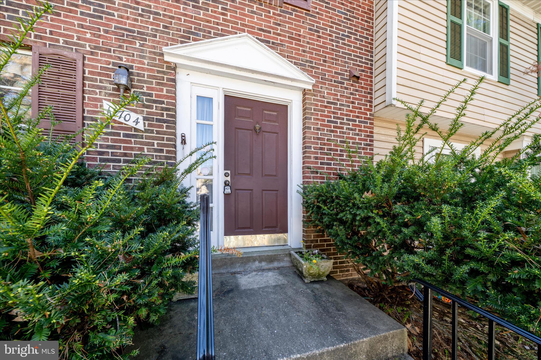11704 Lone Tree Court Columbia, MD 21044 - Photo 21 of 38 a view of a brick house with plants