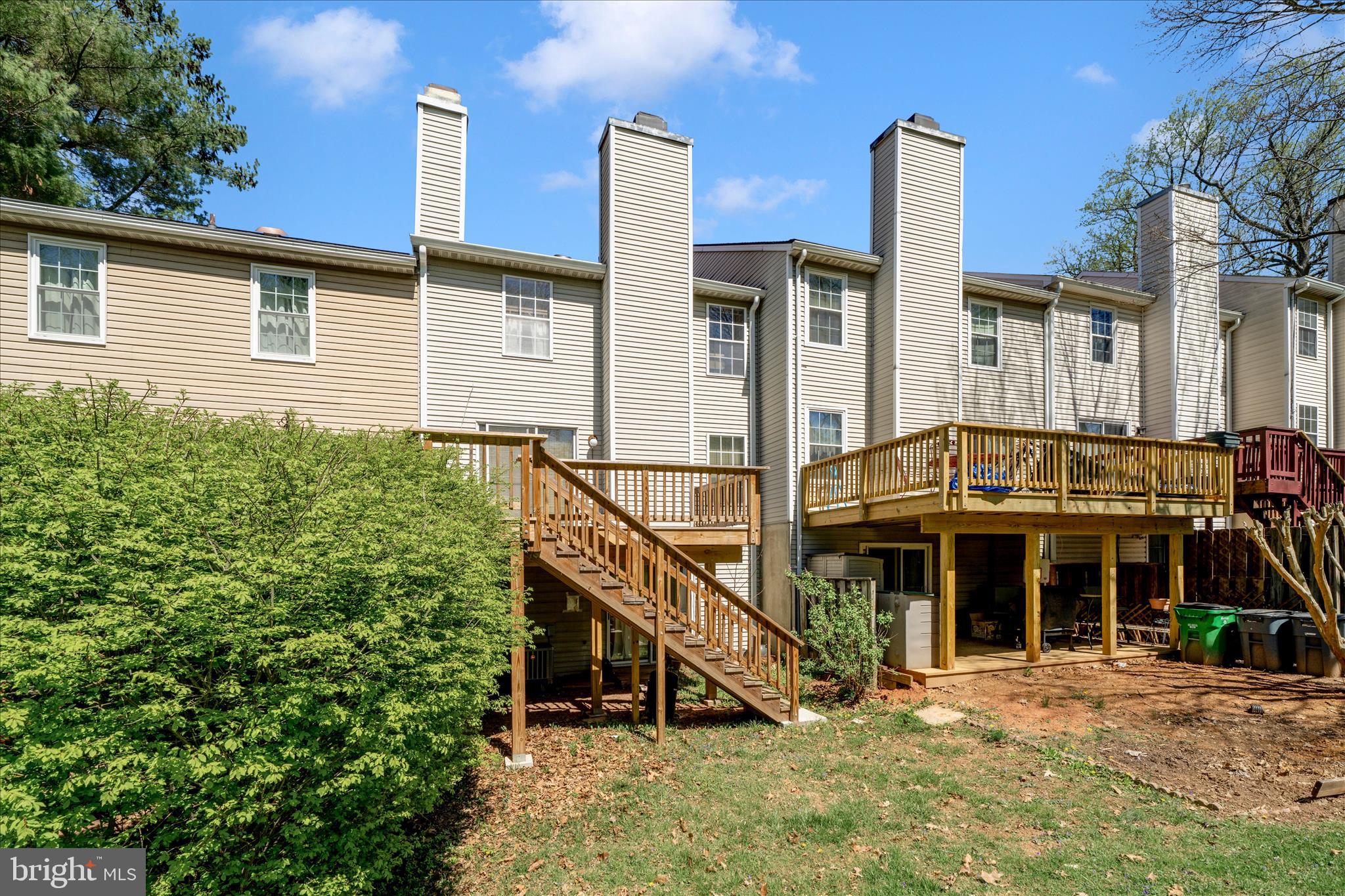 11704 Lone Tree Court Columbia, MD 21044 - Photo 24 of 38 a view of a house with a yard and balcony