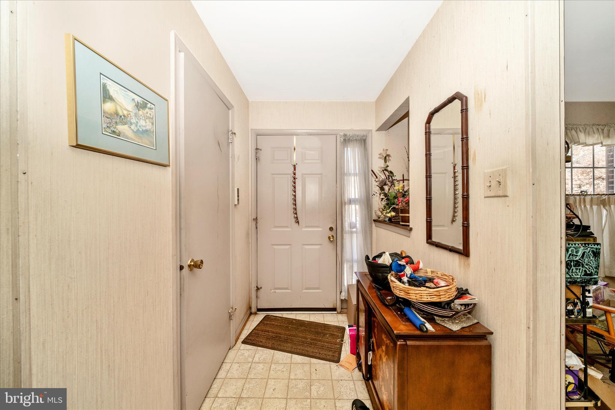 11704 Lone Tree Court Columbia, MD 21044 - Photo 5 of 38 a view of a hallway with workspace and a window