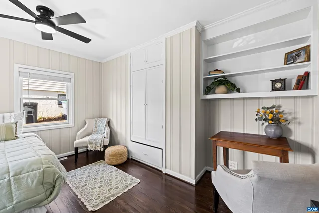 a bedroom with bed and window