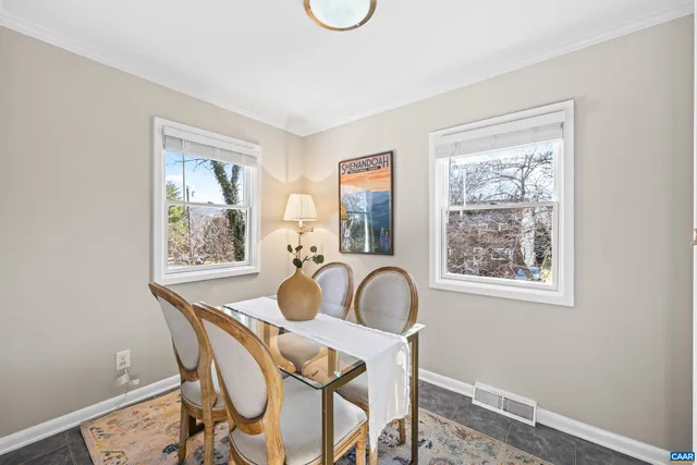 a view of a dining room with furniture window and outside view