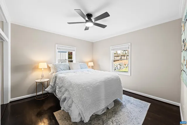 a bedroom with a bed and a lamp