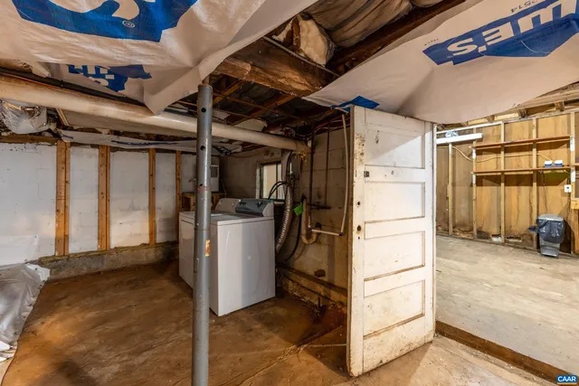 a view of an empty room with stairs