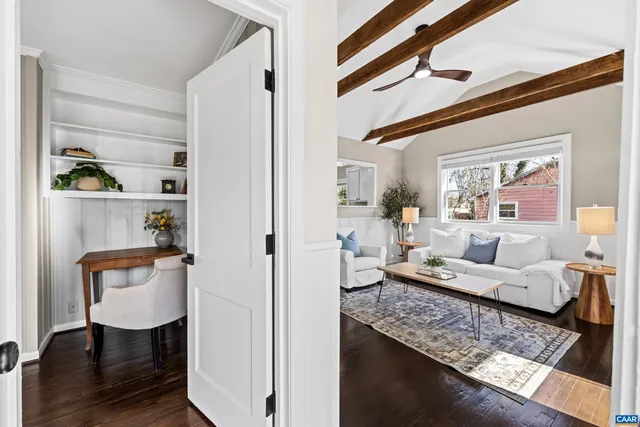 a kitchen with a sink and wooden floor