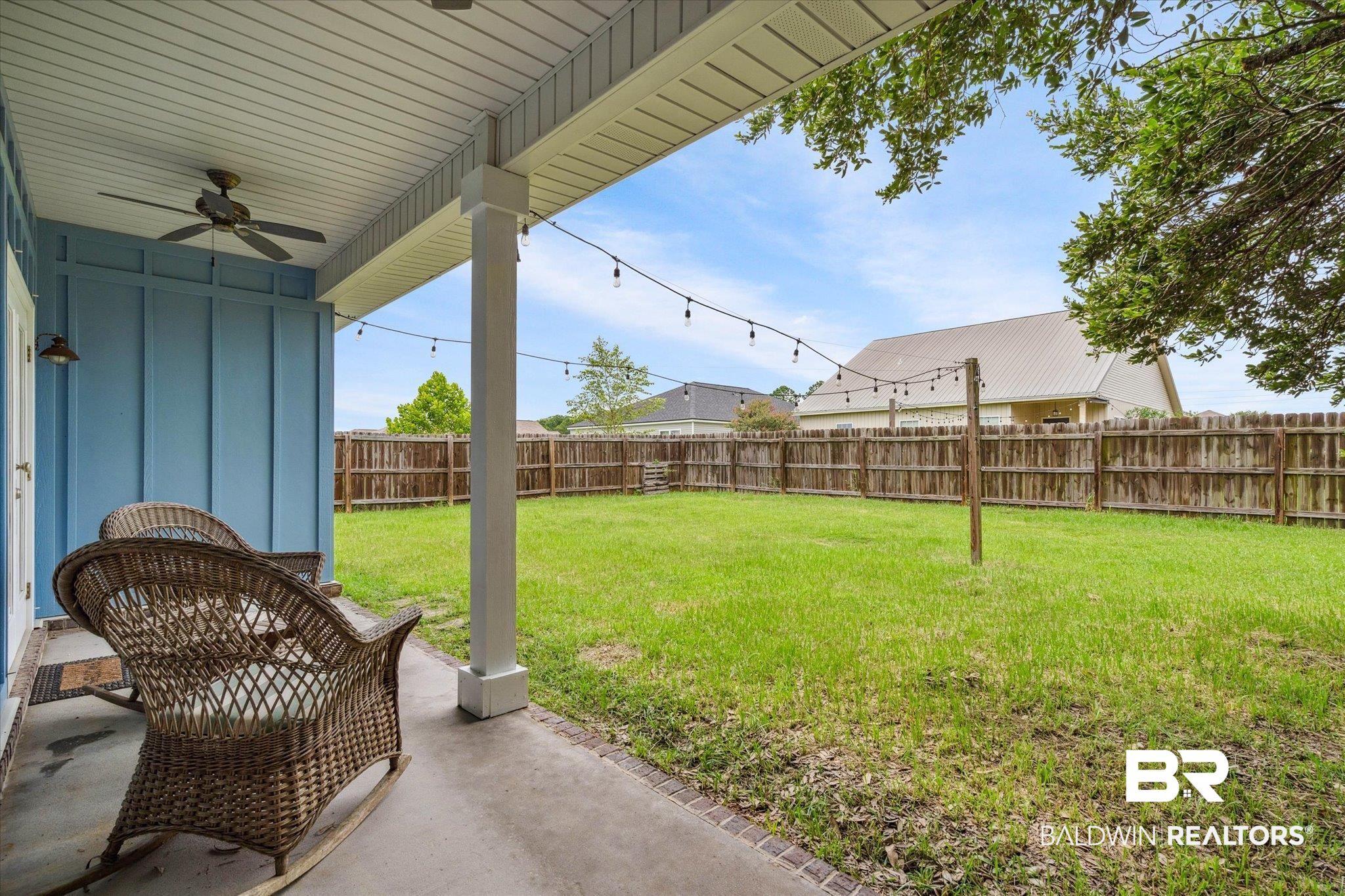 17297 Tallasee Boulevard Foley, AL 36535 - Photo 19 of 24 View of yard featuring a patio and ceiling fan