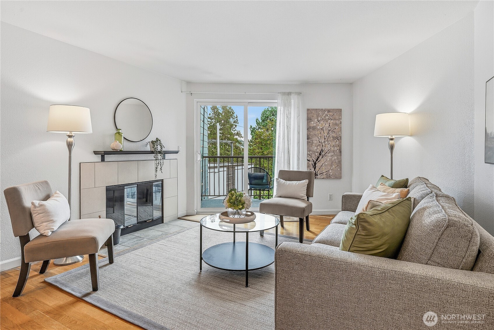 3045 20th Avenue West, Unit 409 Seattle, WA 98199 - Photo 1 of 25 a living room with furniture fireplace and window