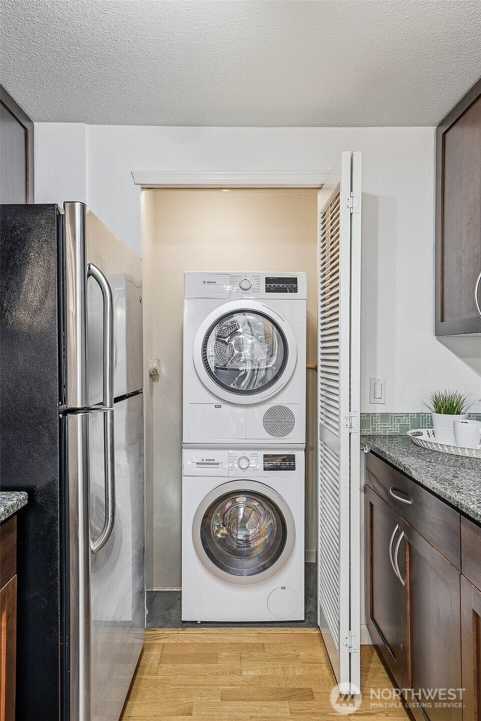 3045 20th Avenue West, Unit 409 Seattle, WA 98199 - Photo 11 of 25 a utility room with dryer and washer