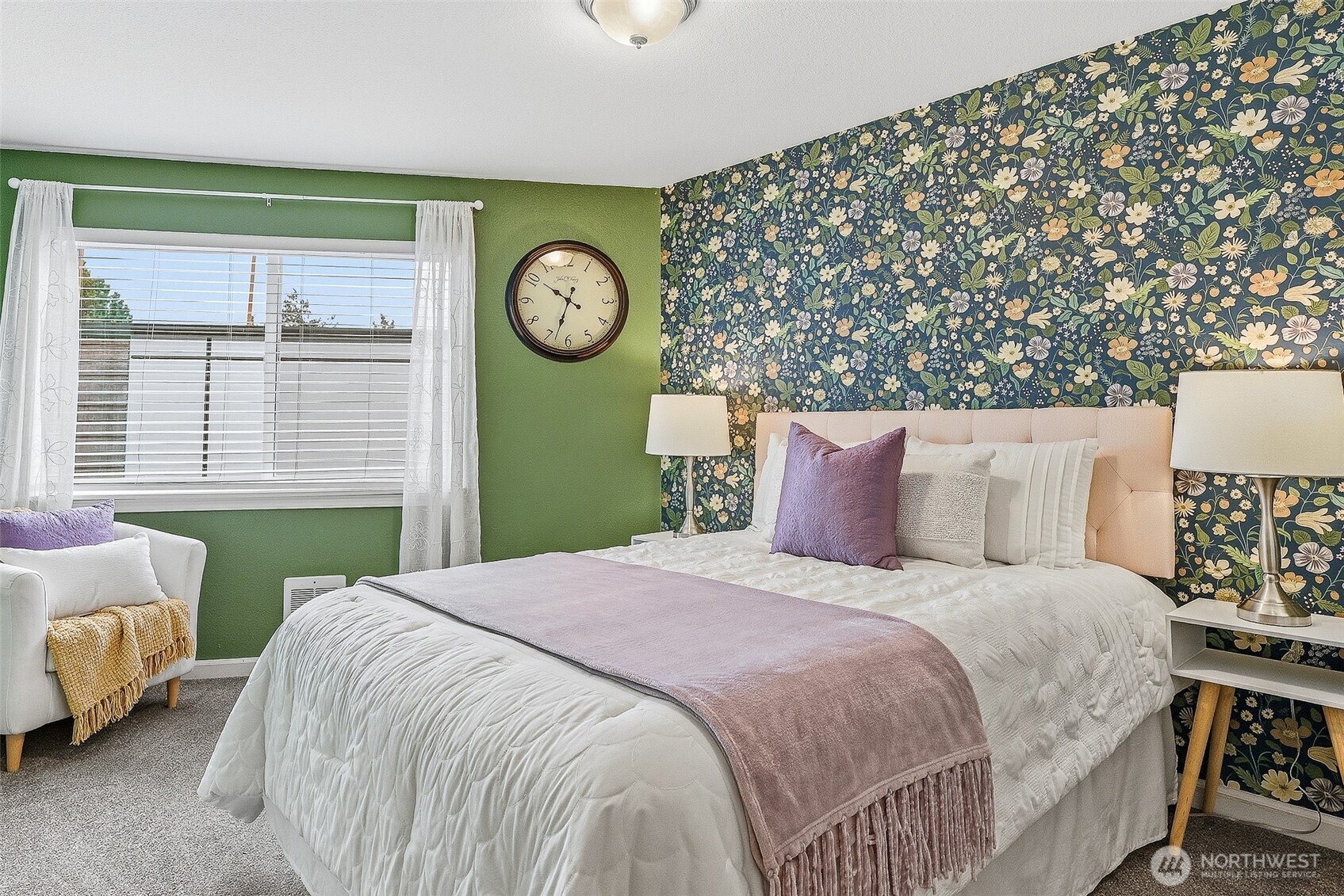 3045 20th Avenue West, Unit 409 Seattle, WA 98199 - Photo 12 of 25 a bedroom with a bed a mirror and a window