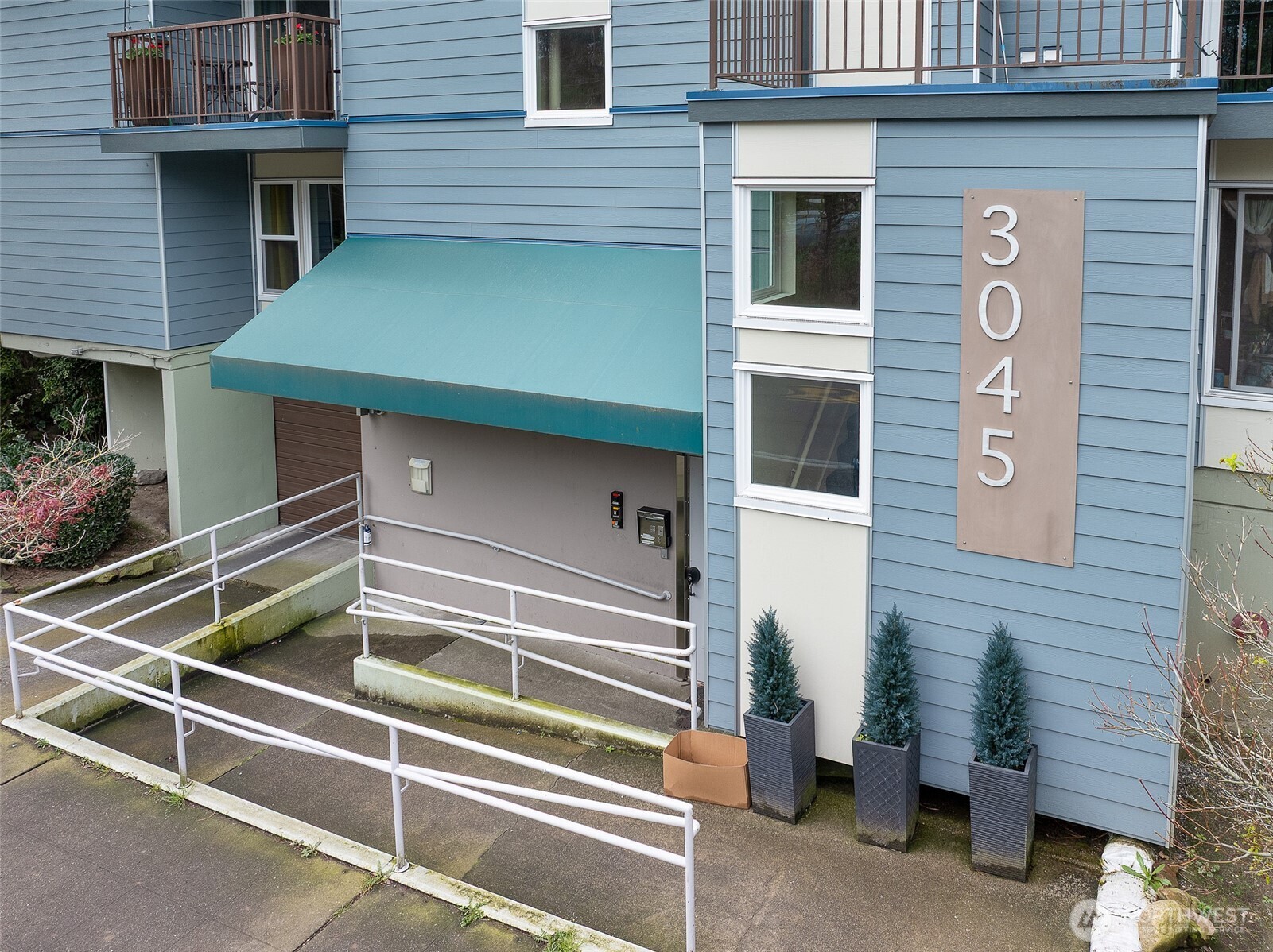 3045 20th Avenue West, Unit 409 Seattle, WA 98199 - Photo 21 of 25 a front view of a house with entryway