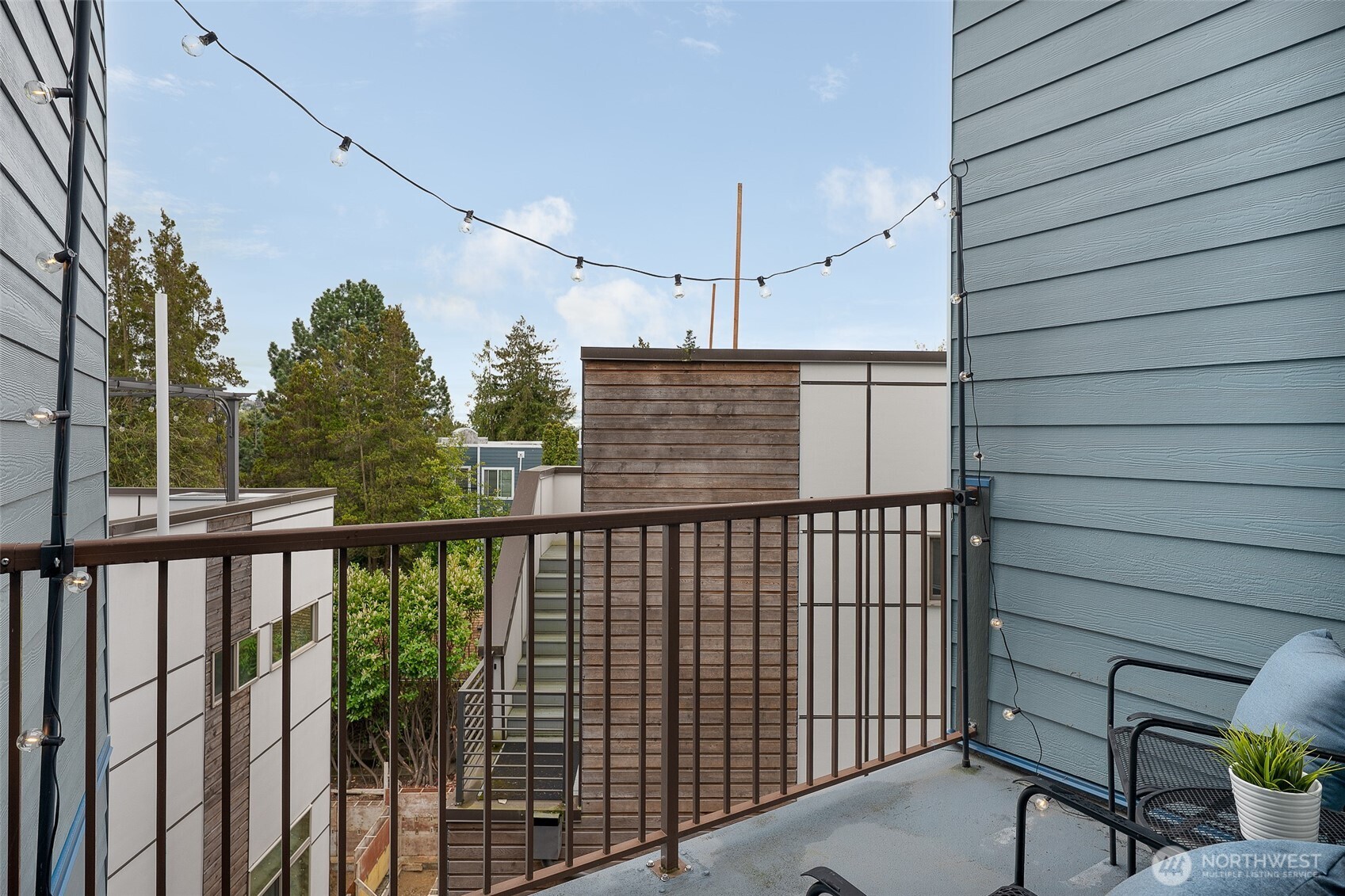 3045 20th Avenue West, Unit 409 Seattle, WA 98199 - Photo 5 of 25 a view of a balcony with wooden floor