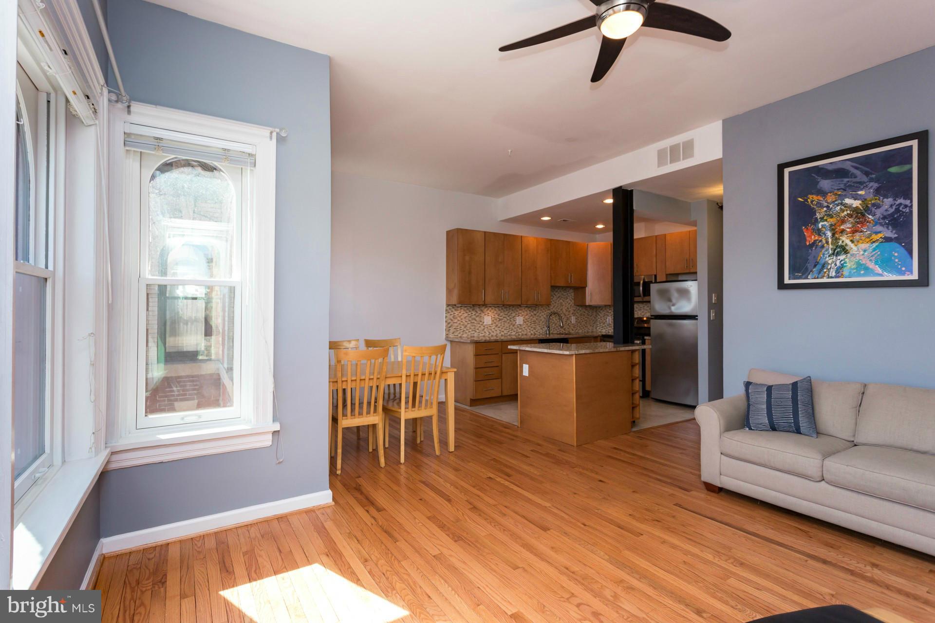 1918 18th Street Northwest, Unit 41 Washington, DC 20009 - Photo 13 of 30 a living room with furniture and kitchen view