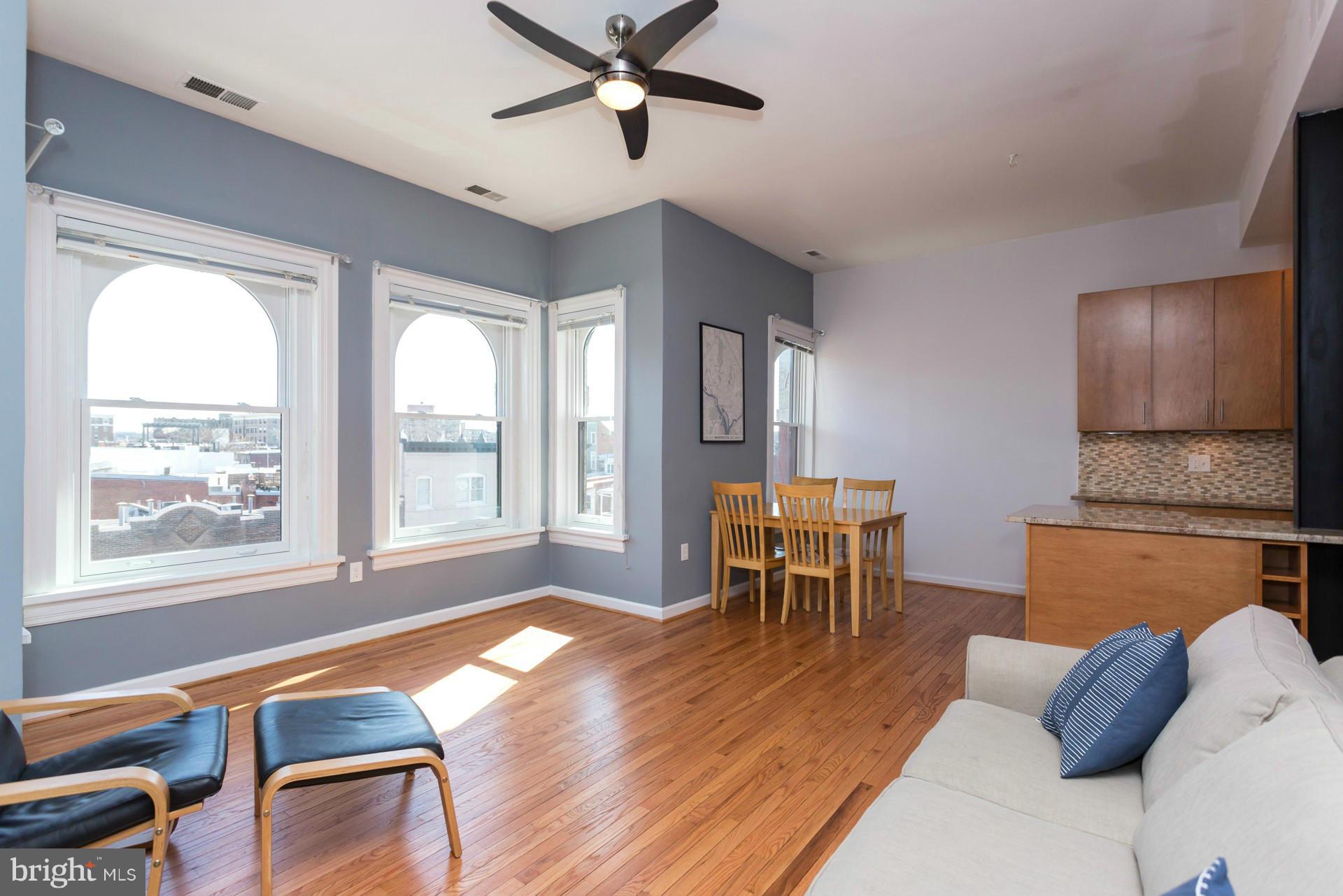 1918 18th Street Northwest, Unit 41 Washington, DC 20009 - Photo 14 of 30 a living room with furniture and a window