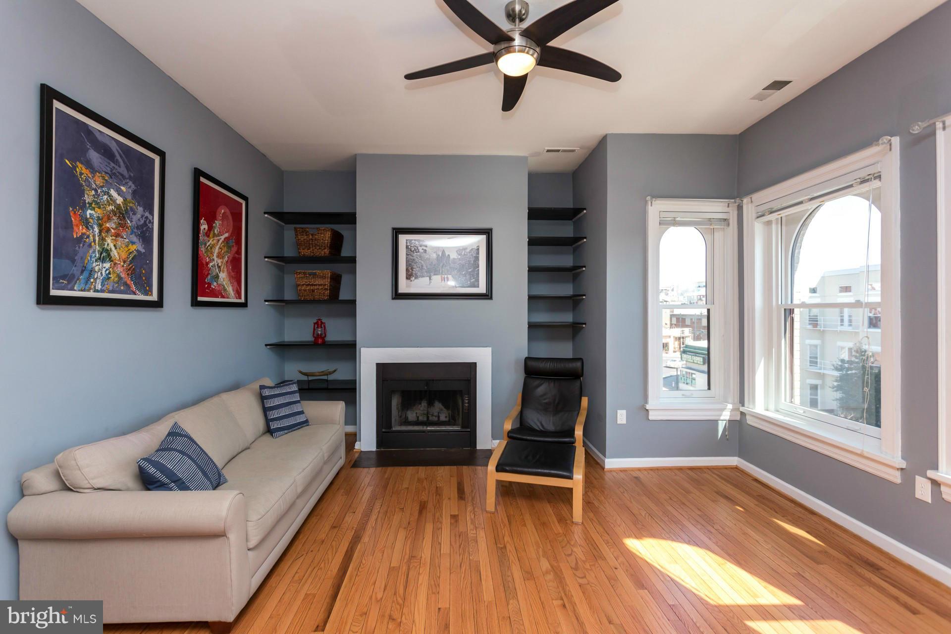1918 18th Street Northwest, Unit 41 Washington, DC 20009 - Photo 16 of 30 a living room with furniture and a fireplace