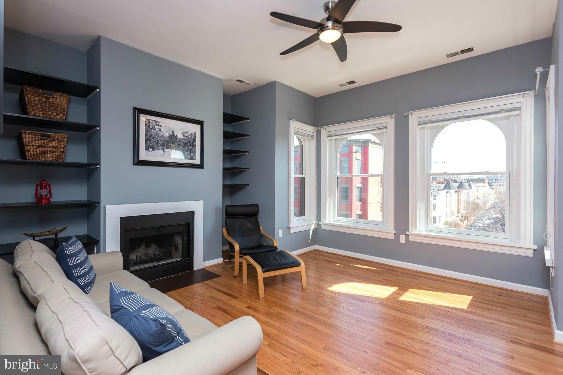 1918 18th Street Northwest, Unit 41 Washington, DC 20009 - Photo 17 of 30 a living room with furniture and a fireplace