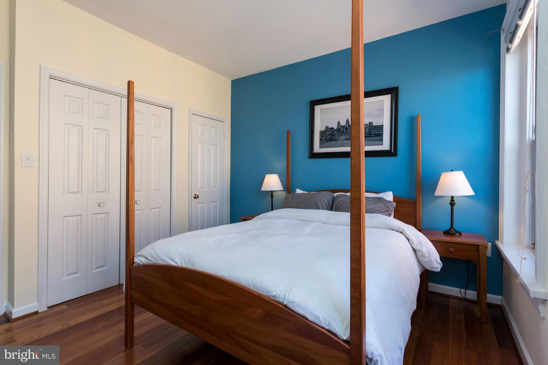 1918 18th Street Northwest, Unit 41 Washington, DC 20009 - Photo 20 of 30 a bedroom with a bed and a lamp
