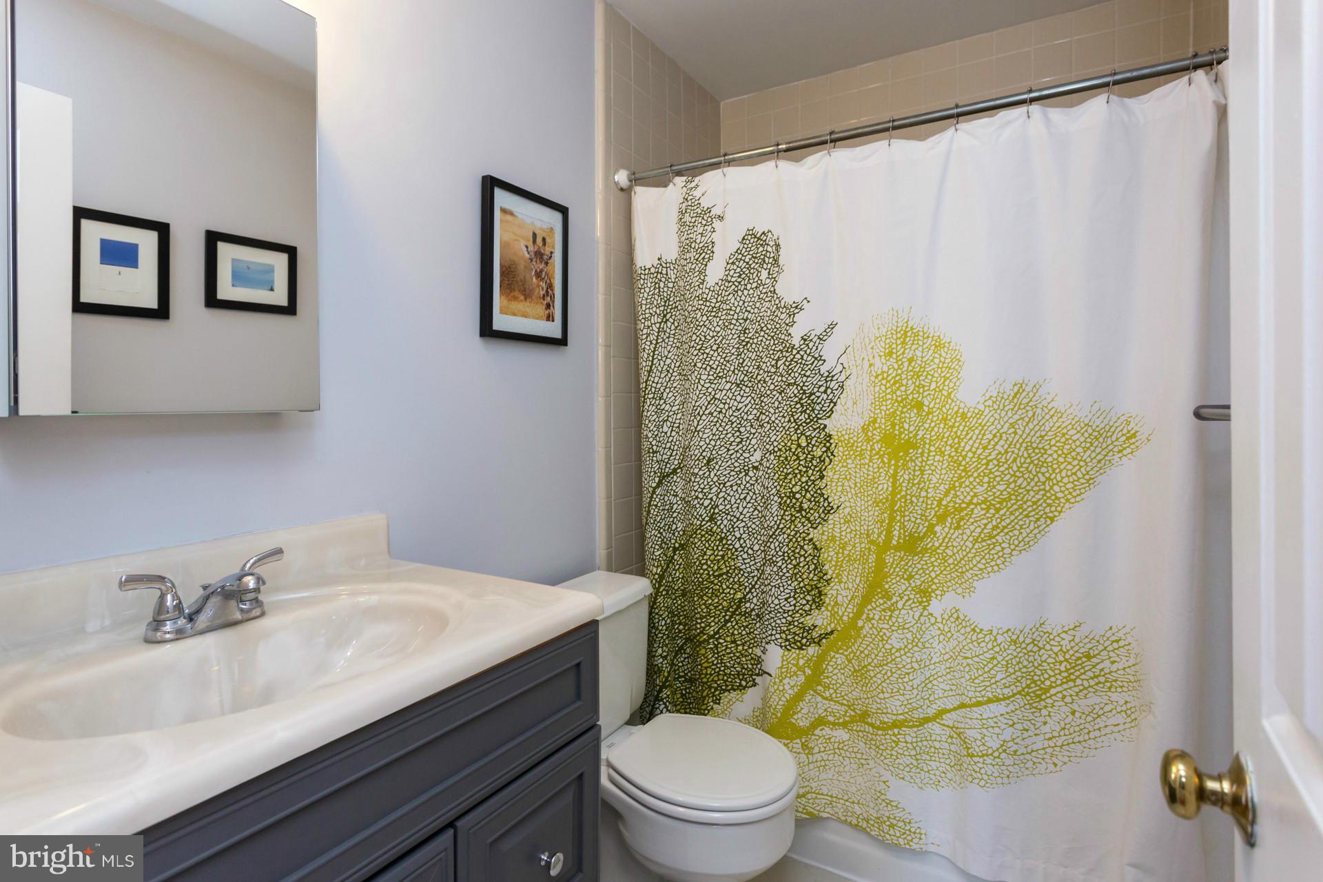 1918 18th Street Northwest, Unit 41 Washington, DC 20009 - Photo 23 of 30 a bathroom with a sink toilet and shower
