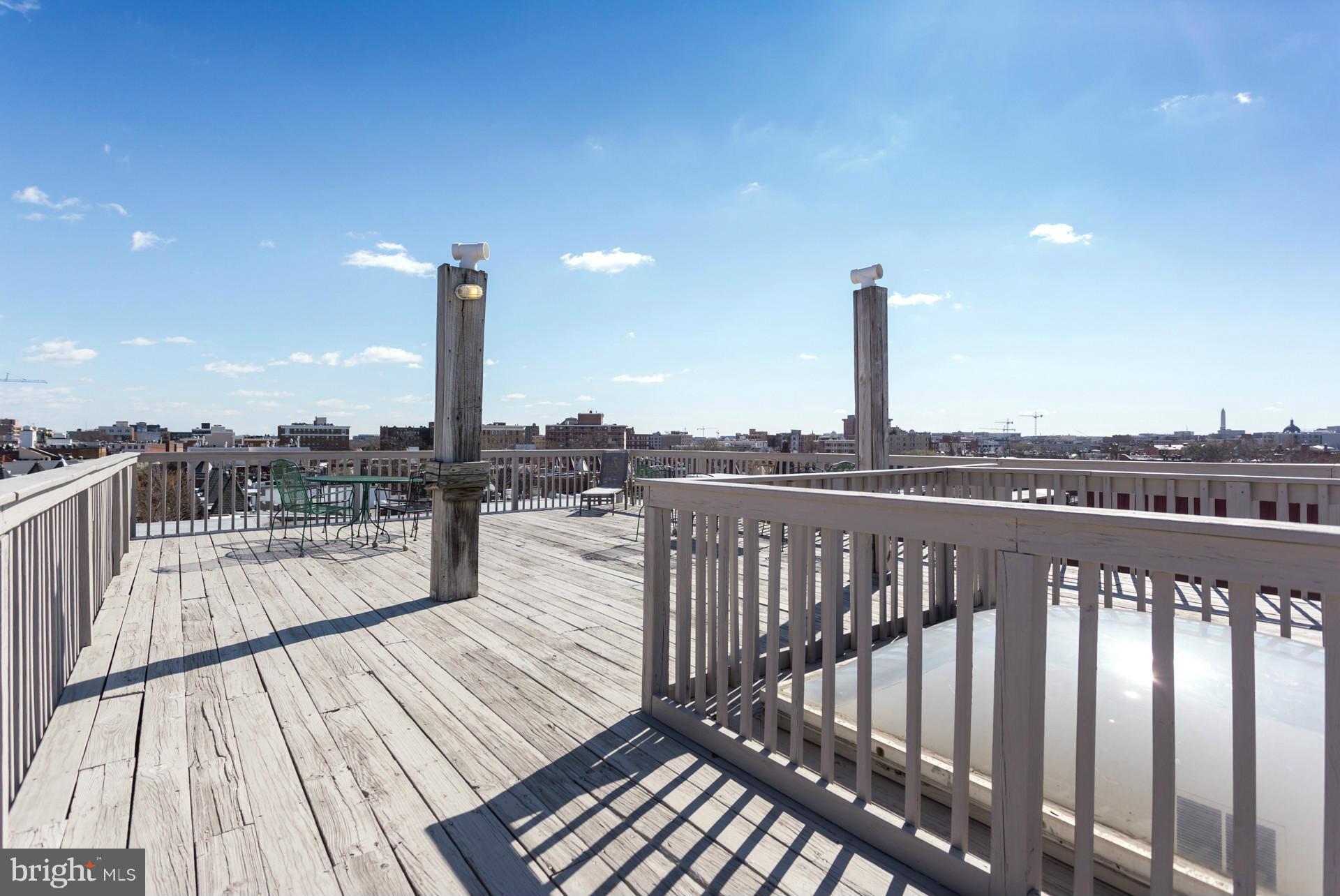 1918 18th Street Northwest, Unit 41 Washington, DC 20009 - Photo 26 of 30 a view of a balcony with wooden floor