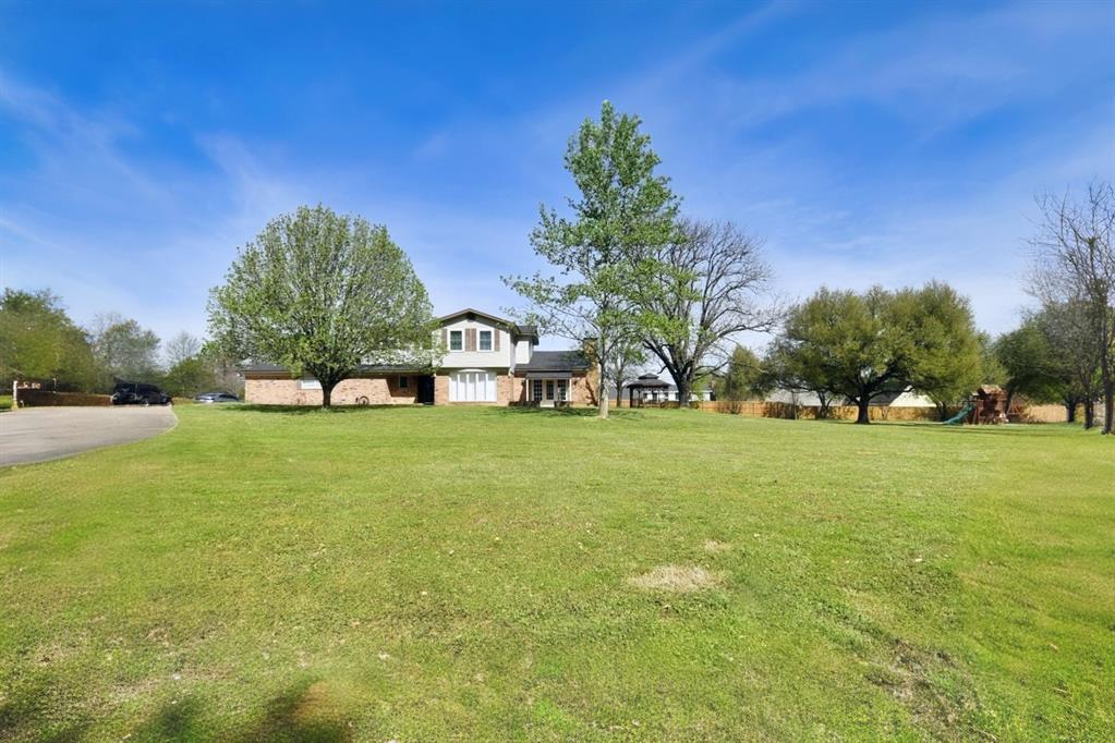 802 West Coke Road Winnsboro, TX 75494 - Photo 1 of 40 a view of a house with a big yard