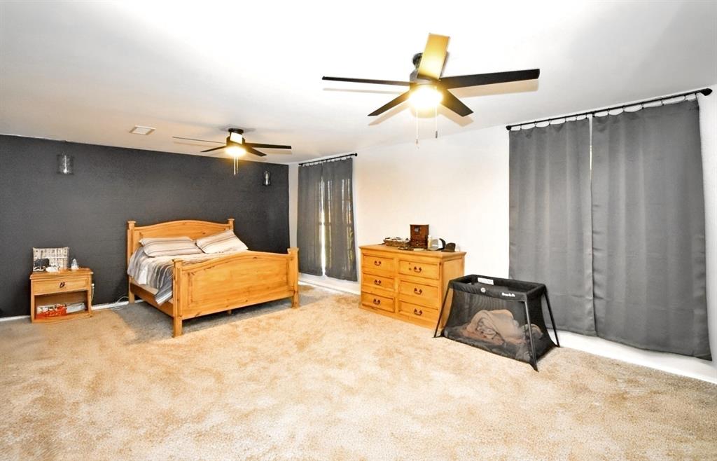 802 West Coke Road Winnsboro, TX 75494 - Photo 26 of 40 a bedroom with furniture and a bed