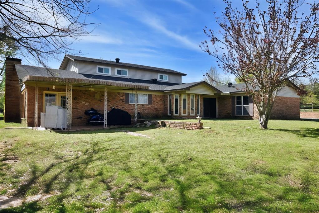 802 West Coke Road Winnsboro, TX 75494 - Photo 4 of 40 a view of a house with a yard