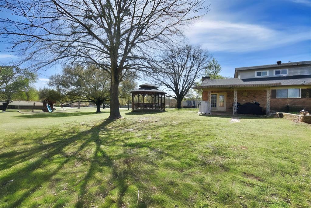802 West Coke Road Winnsboro, TX 75494 - Photo 5 of 40 a view of house with outdoor space and garden
