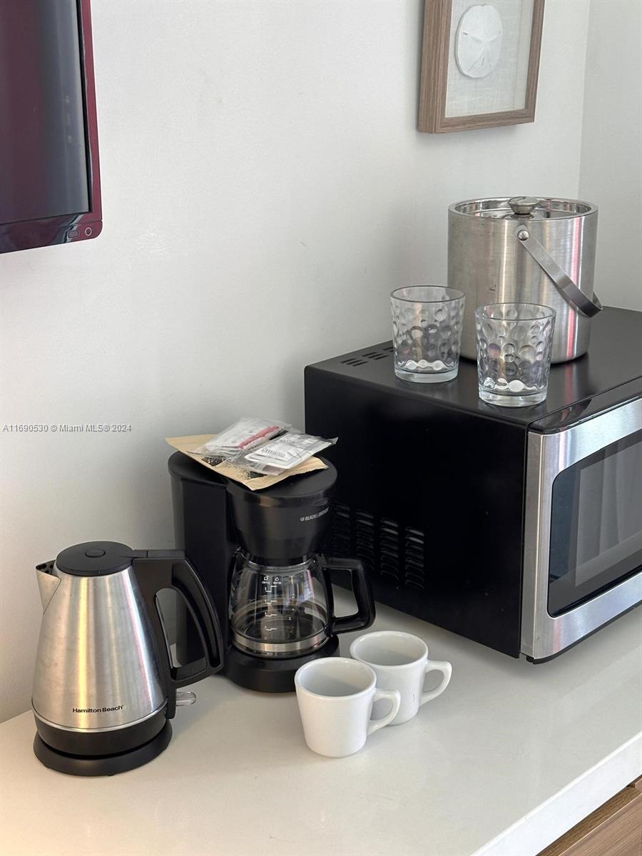 2602 East Hallandale Beach Boulevard, Unit R610 Hallandale Beach, FL 33009 - Photo 13 of 17 a view of a dining room with furniture