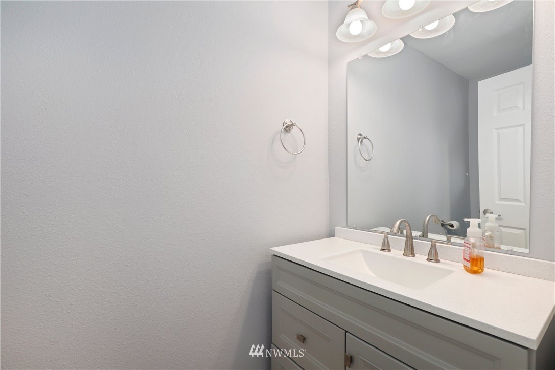 21521 4th Avenue West, Unit C22 Bothell, WA 98021 - Photo 22 of 33 a bathroom with a sink and a mirror