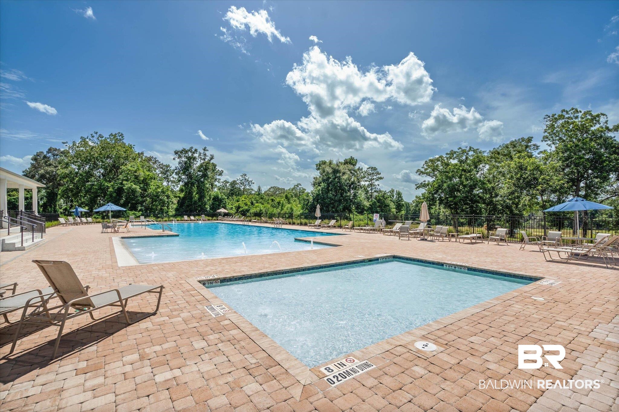 10541 Heirloom Road South Mobile, AL 36608 - Photo 21 of 23 Expansive outdoor pool area featuring a large main pool, a smaller wading pool, and a spacious paver patio