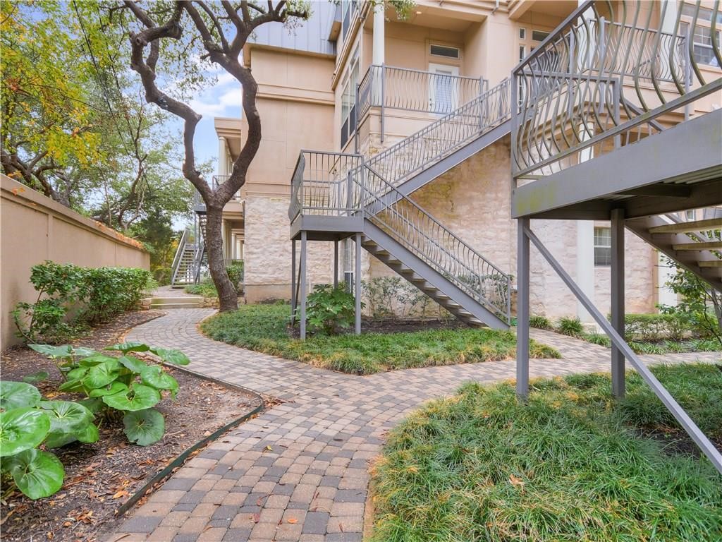 2918 Ranch Road 620 North, Unit W221 Austin, TX 78734 - Photo 16 of 20 a view of a house with a yard and potted plants