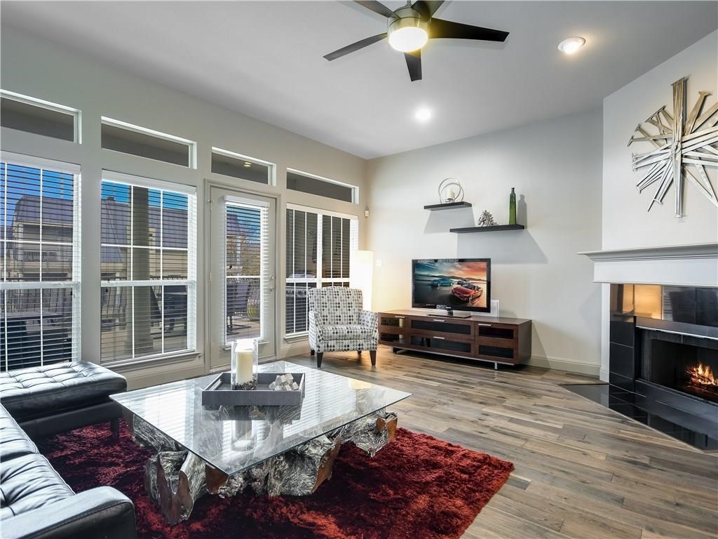 2918 Ranch Road 620 North, Unit W221 Austin, TX 78734 - Photo 3 of 20 a living room with furniture and a fireplace