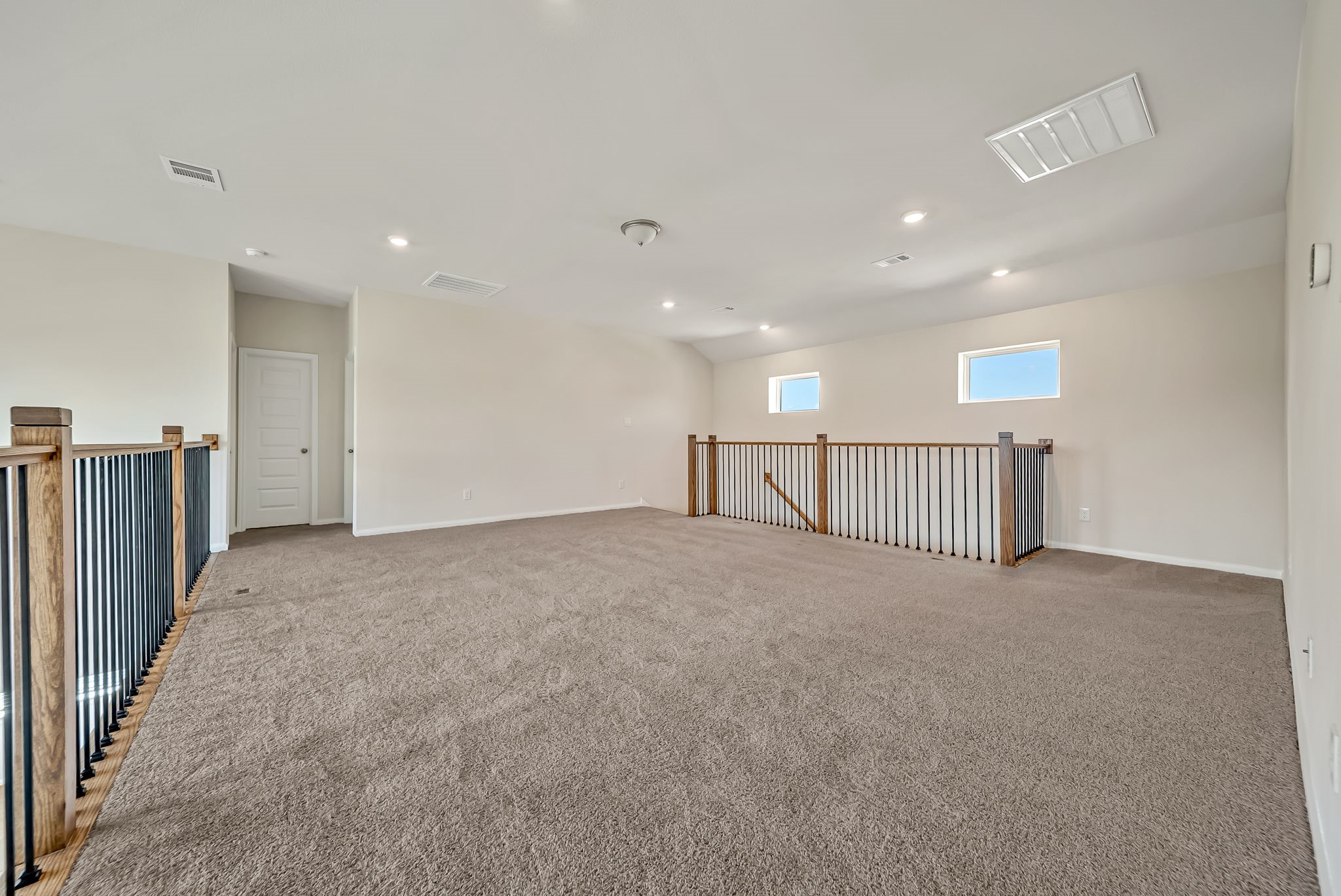 20629 Dynamic Court Humble, TX 77338 - Photo 15 of 26 a view of a hall with a staircase
