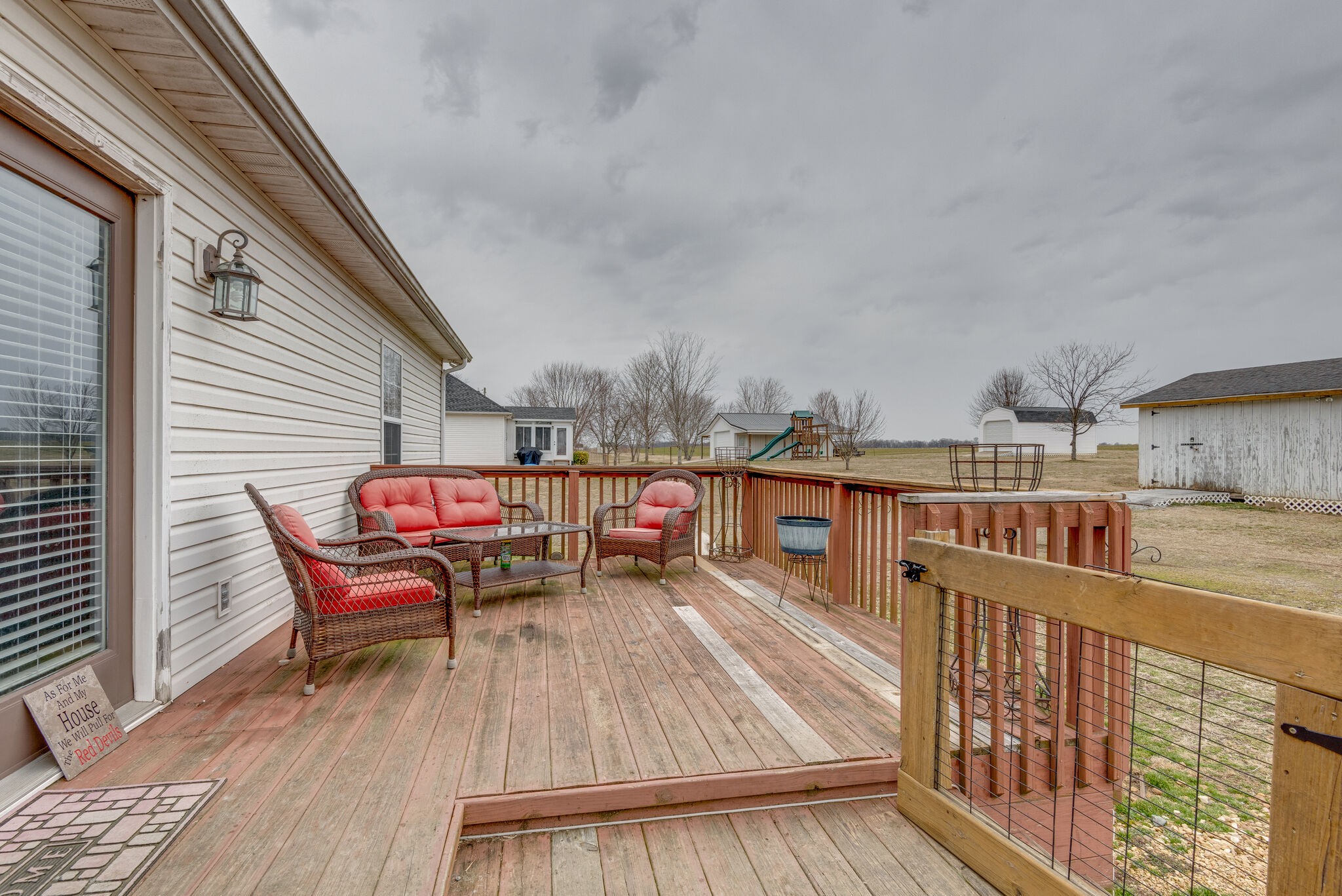 4329 Matthews Road Cedar Hill, TN 37032 - Photo 3 of 17 a roof deck with a barbeque and wooden floor