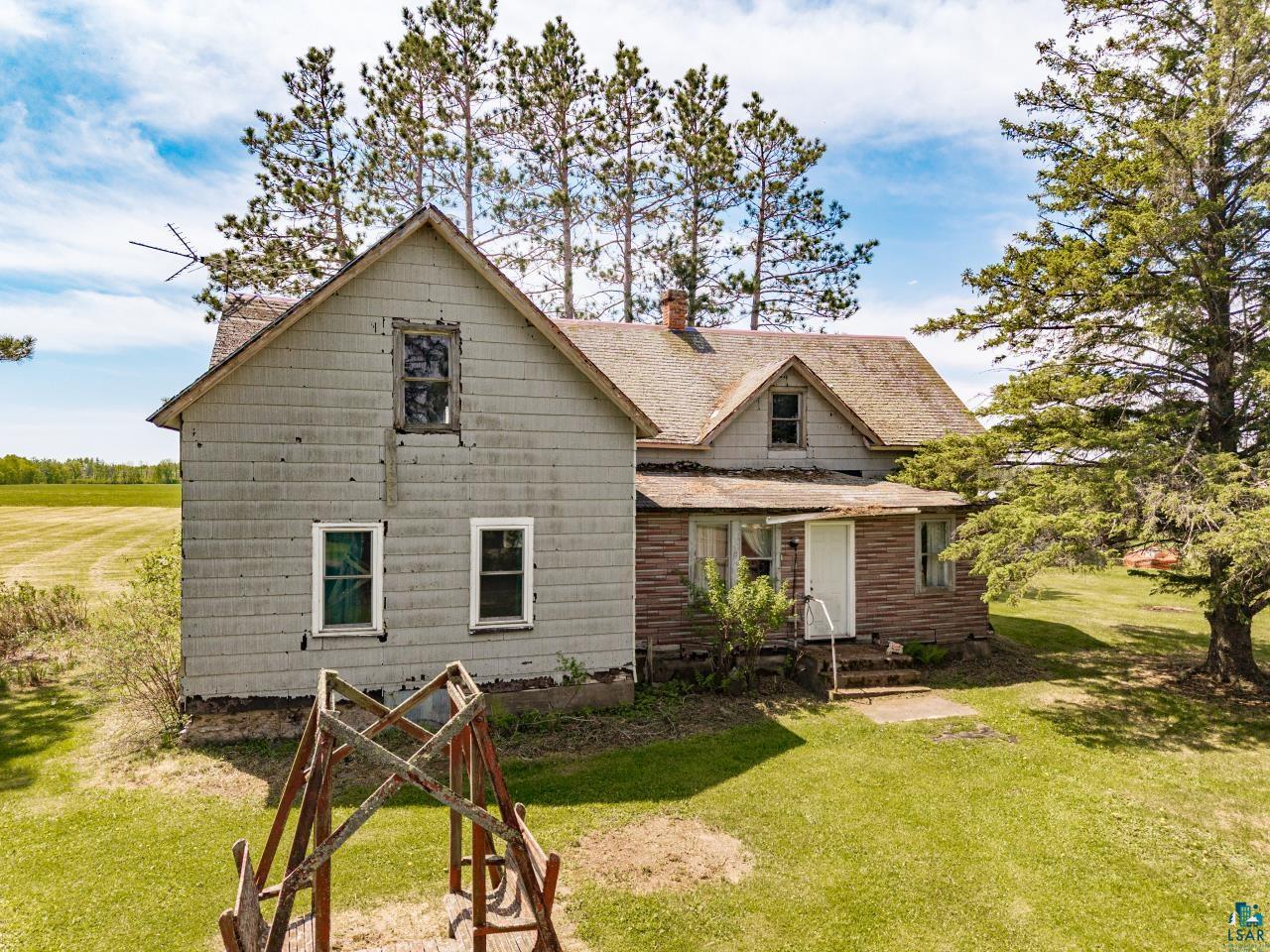 6606 Metso Road Kettle River, MN 55757 - Photo 43 of 84 Rural property featuring a two-story residence with gray siding and an attached single-story structure