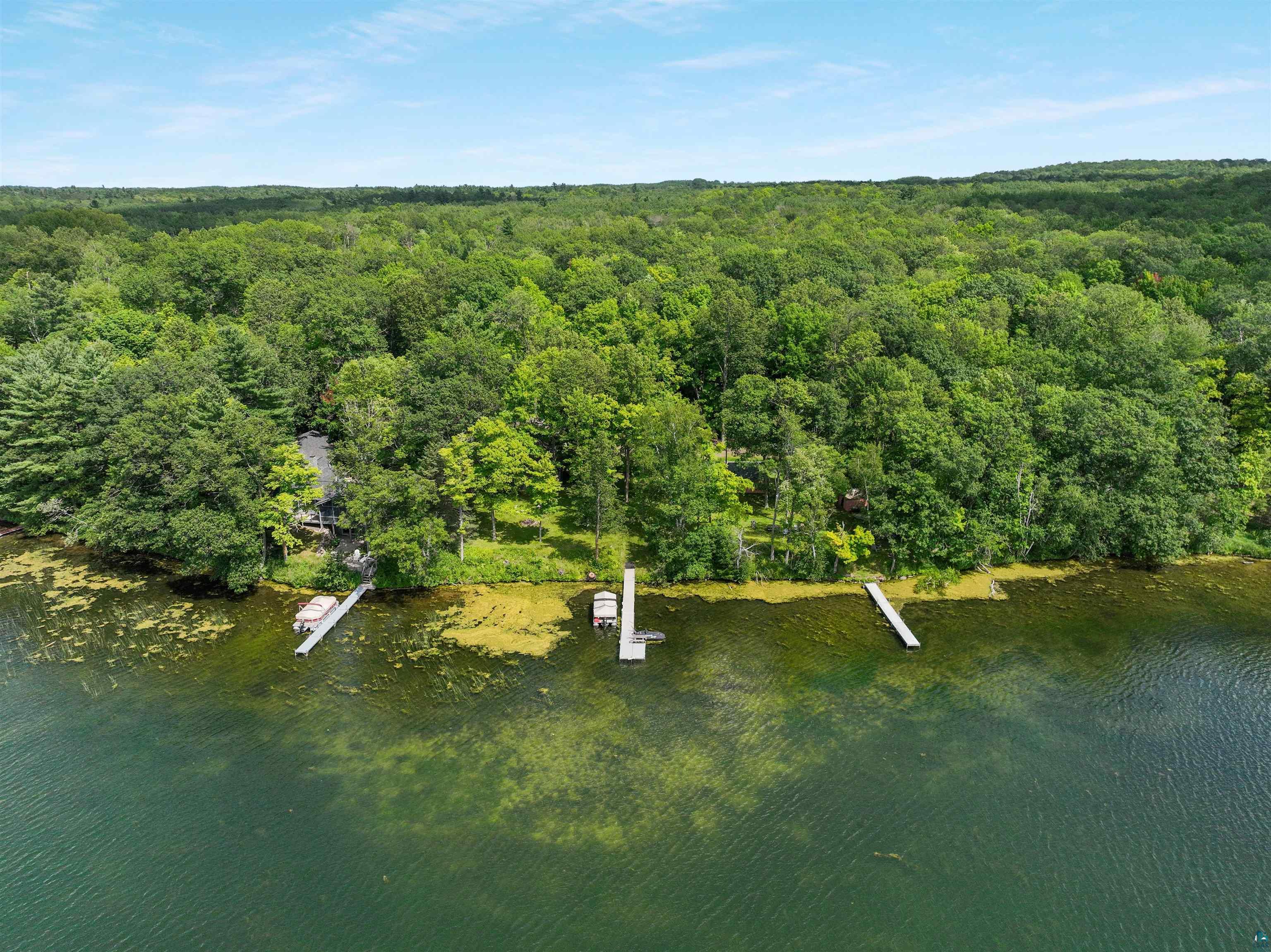 N5063 First Street Spooner, WI 54801 - Photo 12 of 36 Birds eye view of property with a water view