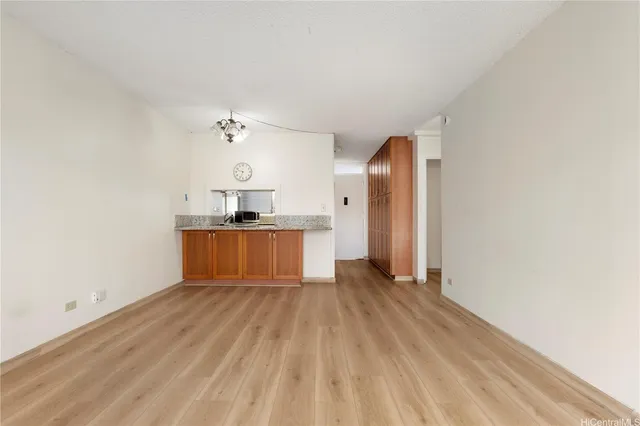 a view of a kitchen with a sink and a window