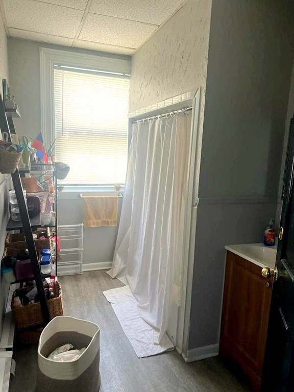 317 Nesmith Street Lowell, MA 01852 - Photo 11 of 16 a bathroom with a sink toilet and shower