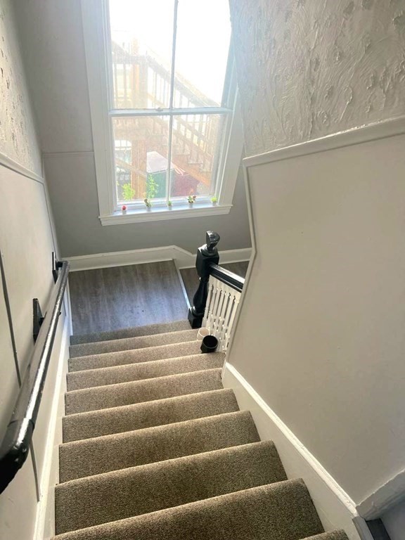 317 Nesmith Street Lowell, MA 01852 - Photo 13 of 16 a view of entryway with wooden floor
