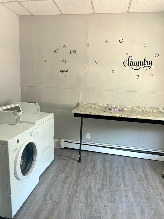317 Nesmith Street Lowell, MA 01852 - Photo 3 of 16 a utility room with dryer and washer
