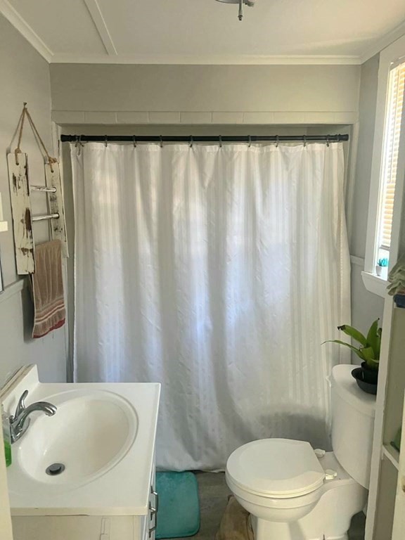 317 Nesmith Street Lowell, MA 01852 - Photo 10 of 16 a bathroom with a sink and a mirror