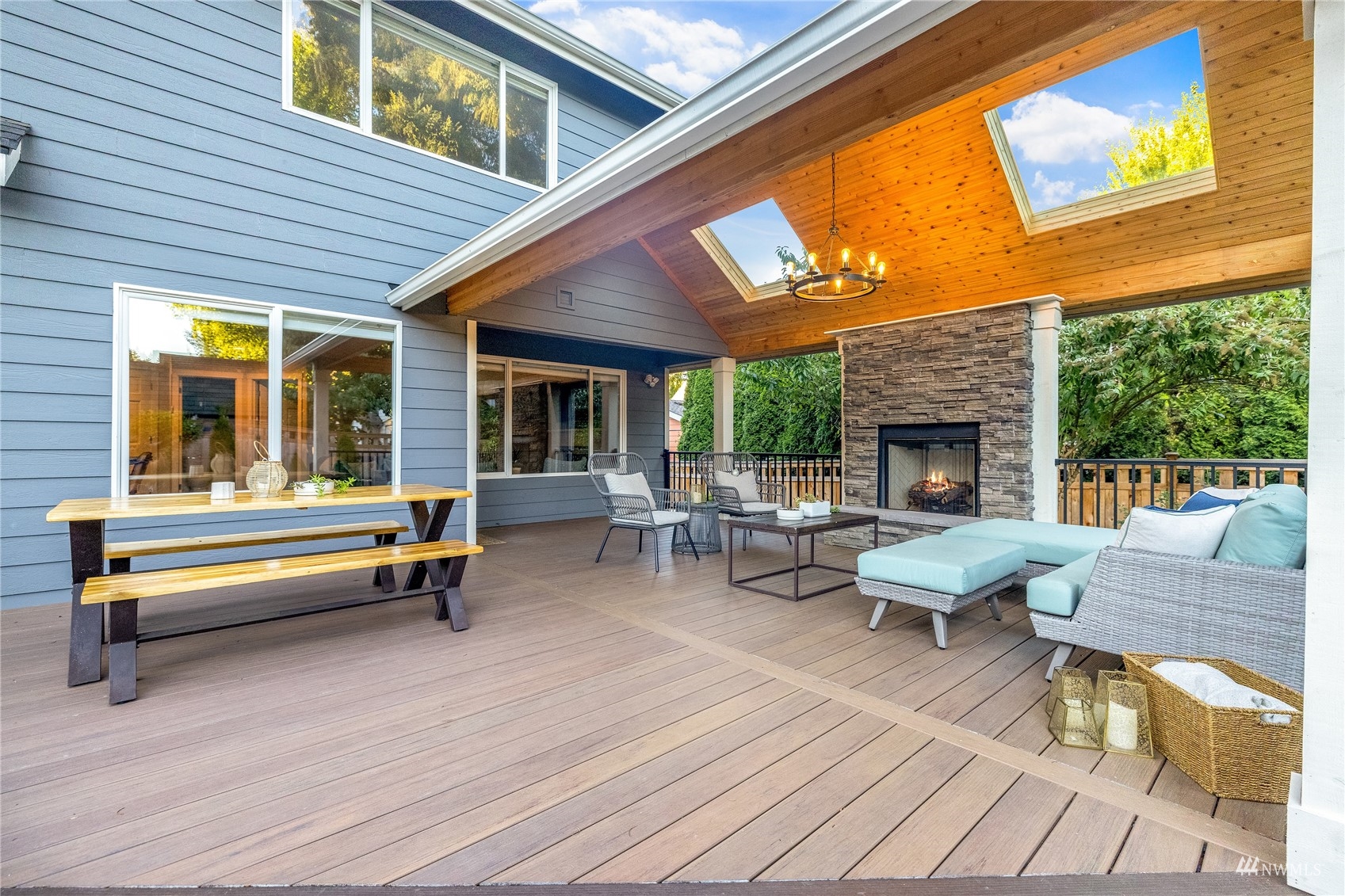 9419 Northeast 175th Street Bothell, WA 98011 - Photo 11 of 28 a living room with patio furniture and a fireplace