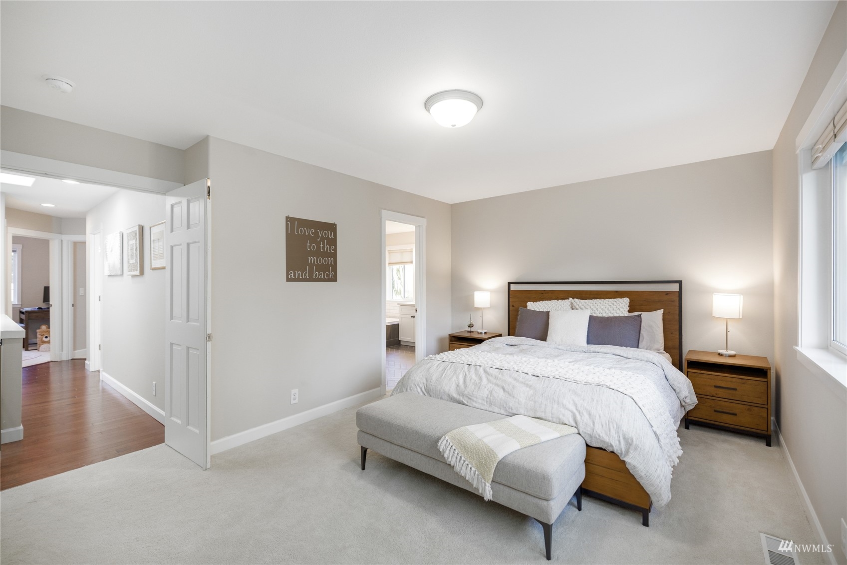 9419 Northeast 175th Street Bothell, WA 98011 - Photo 16 of 28 a bedroom with a bed and a lamp