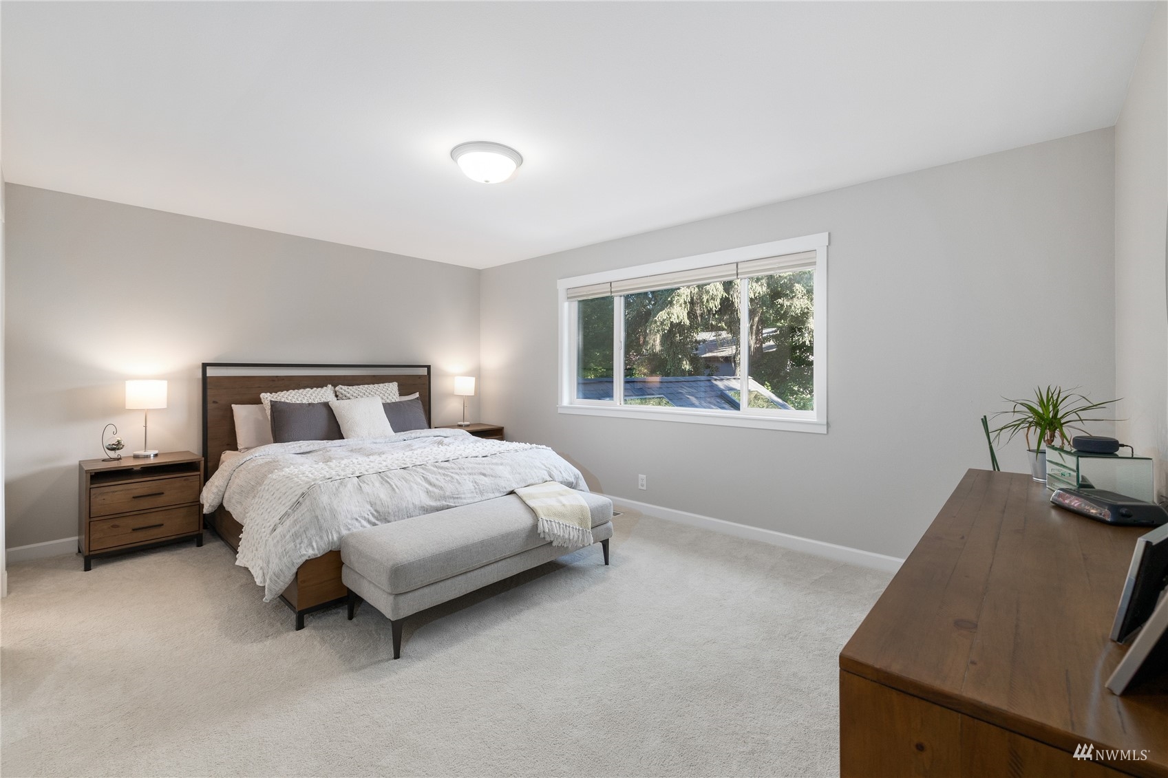 9419 Northeast 175th Street Bothell, WA 98011 - Photo 17 of 28 a bedroom with a bed and a window