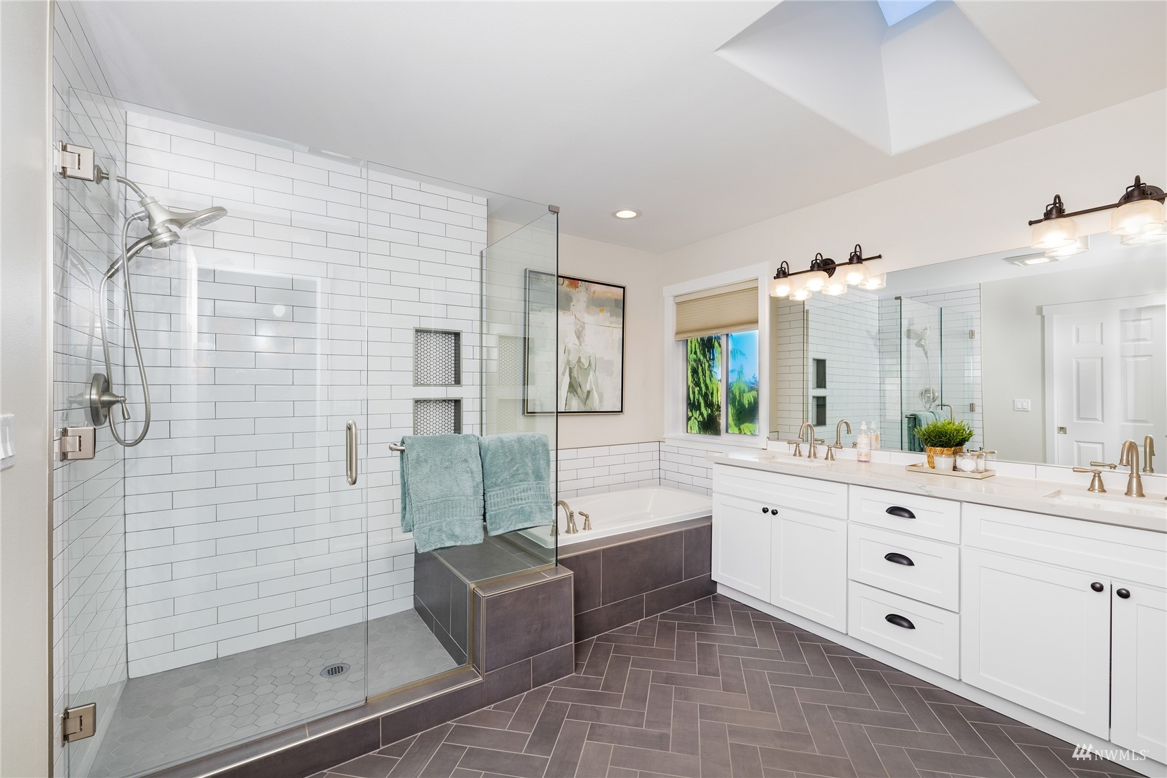 9419 Northeast 175th Street Bothell, WA 98011 - Photo 18 of 28 a spacious bathroom with a granite countertop sink mirror and shower