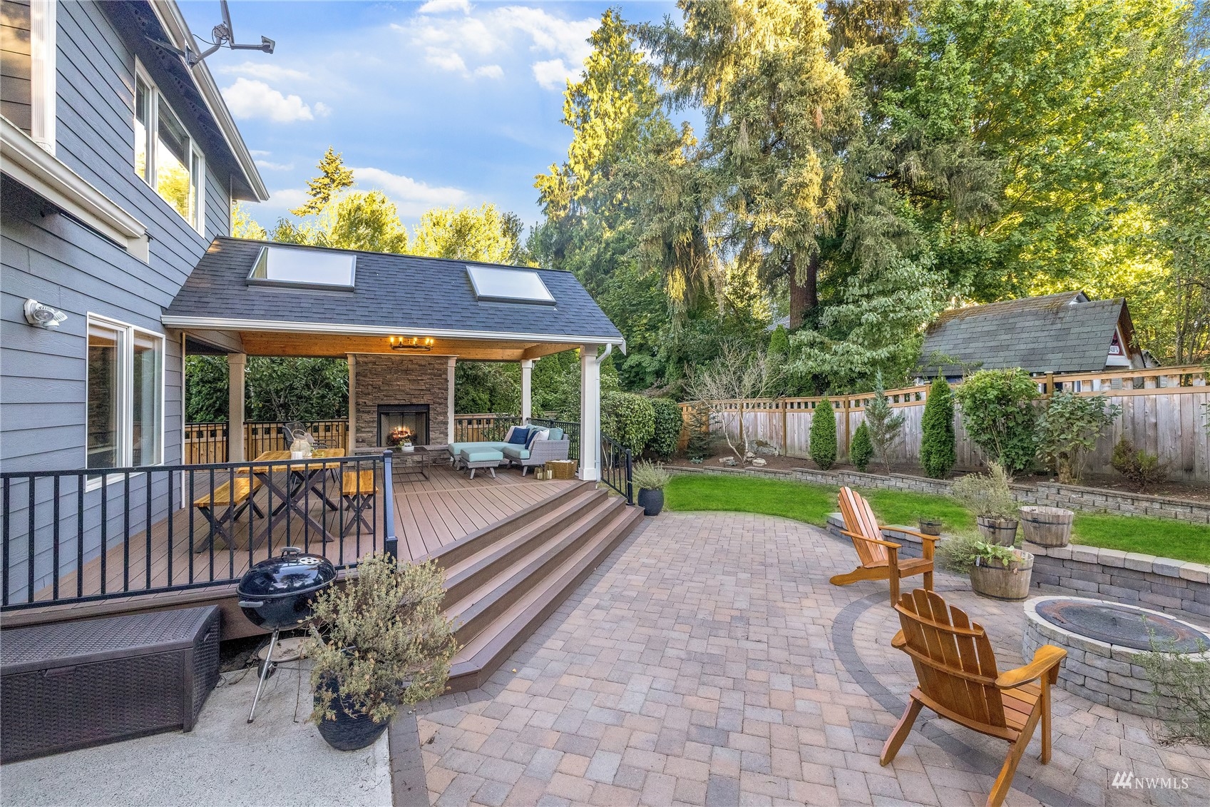 9419 Northeast 175th Street Bothell, WA 98011 - Photo 24 of 28 a view of house with backyard and outdoor seating