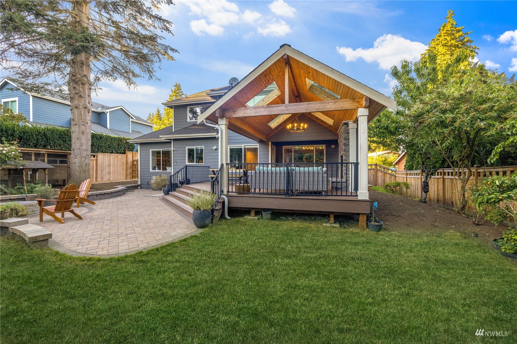 9419 Northeast 175th Street Bothell, WA 98011 - Photo 25 of 28 a front view of a house with garden and sitting area