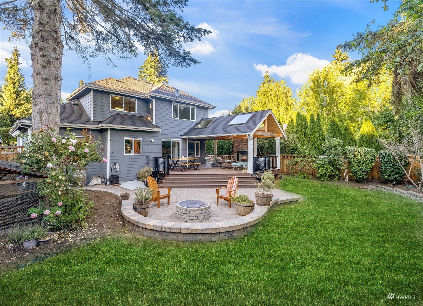 9419 Northeast 175th Street Bothell, WA 98011 - Photo 26 of 28 a view of a house with swimming pool and sitting area
